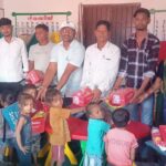 Distribution of clothes and bags among children in Anganwadi centers of Basaria