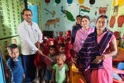 The head distributed sweaters among the children at the Anganwadi Center in Dhanwar
