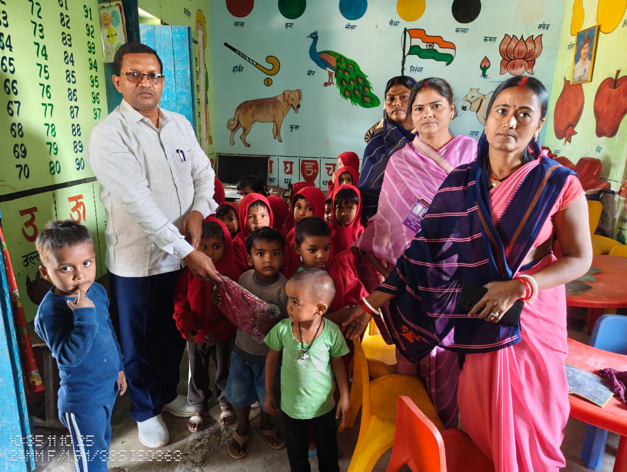 The head distributed sweaters among the children at the Anganwadi Center in Dhanwar