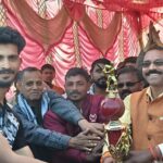 Cricket tournament concludes in Singhrawan Mukhiya Birendra Rajak encourages the winning team by giving them a trophy