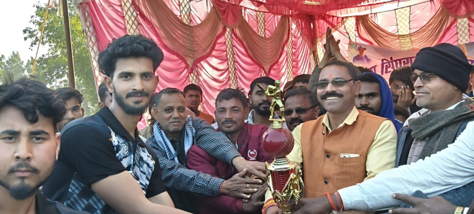 Cricket tournament concludes in Singhrawan Mukhiya Birendra Rajak encourages the winning team by giving them a trophy